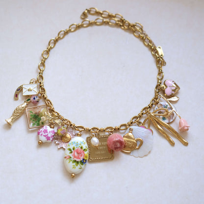 Vintage Charm Necklace - Gold Chain with Floral, Fish & Tea Accents