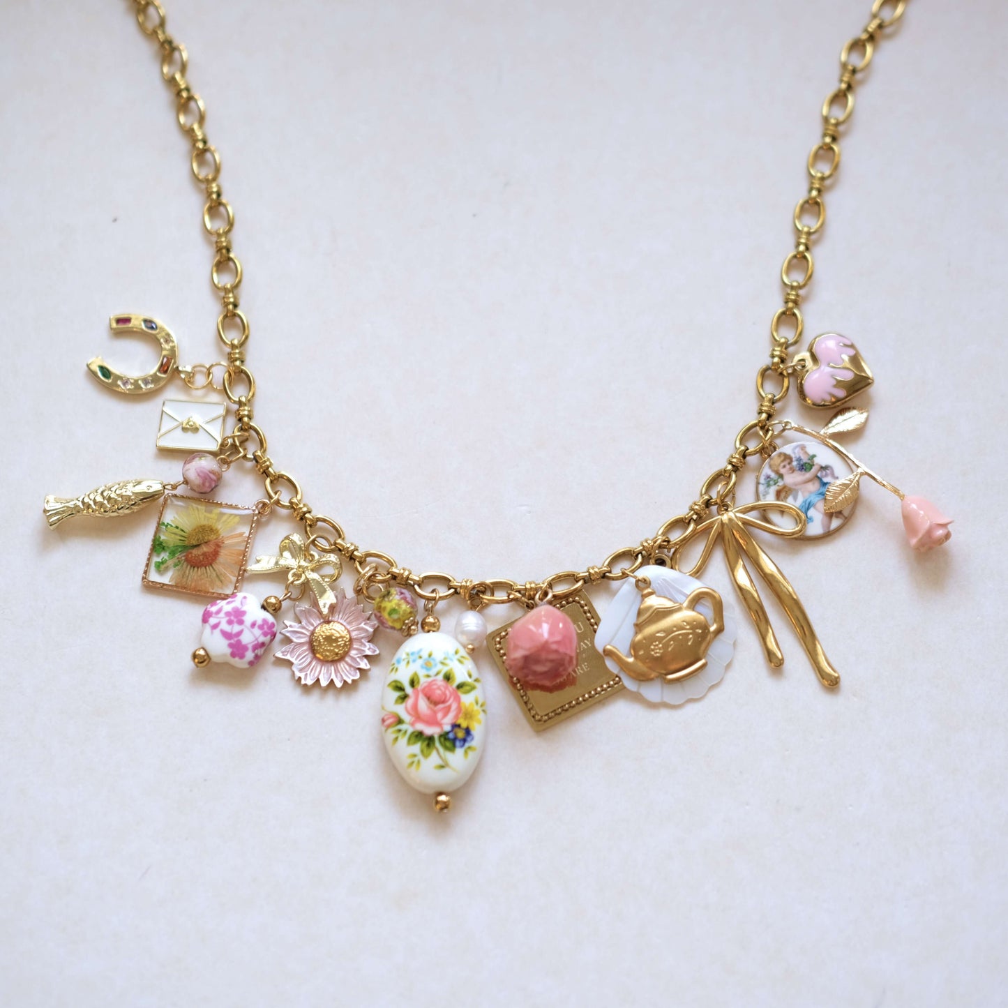 Vintage Charm Necklace - Gold Chain with Floral, Fish & Tea Accents