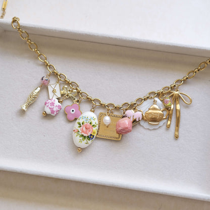 Vintage Charm Necklace - Gold Chain with Floral, Fish & Tea Accents